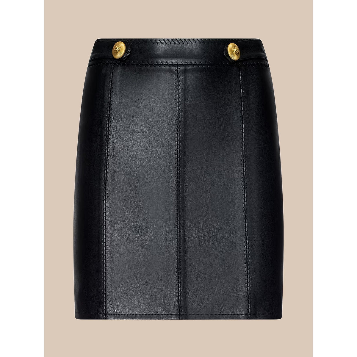 A black faux-leather mini skirt with vertical seam panels and two gold-tone metal buttons at the waistband, shown against a solid beige background.