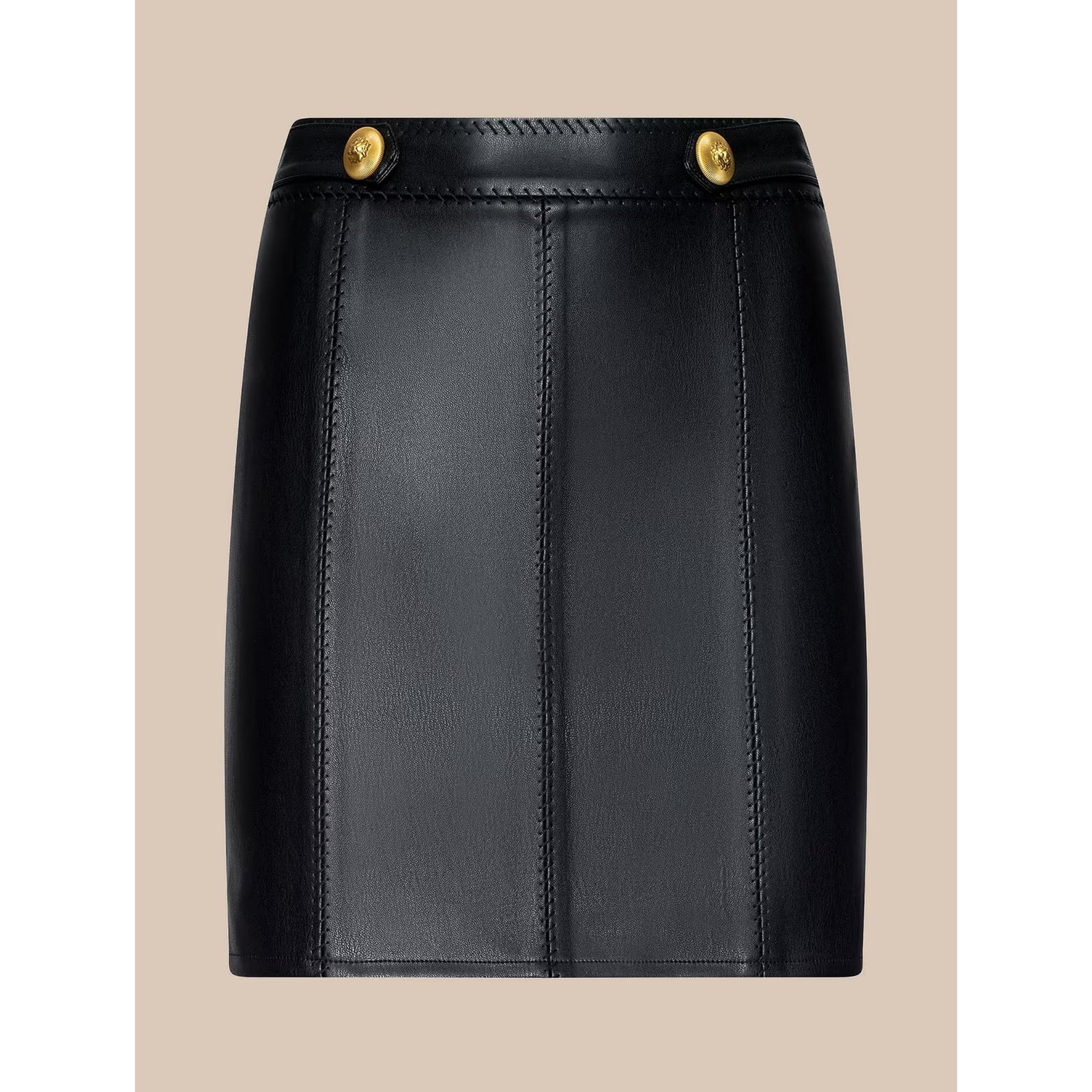 A black faux-leather mini skirt with vertical seam panels and two gold-tone metal buttons at the waistband, shown against a solid beige background.