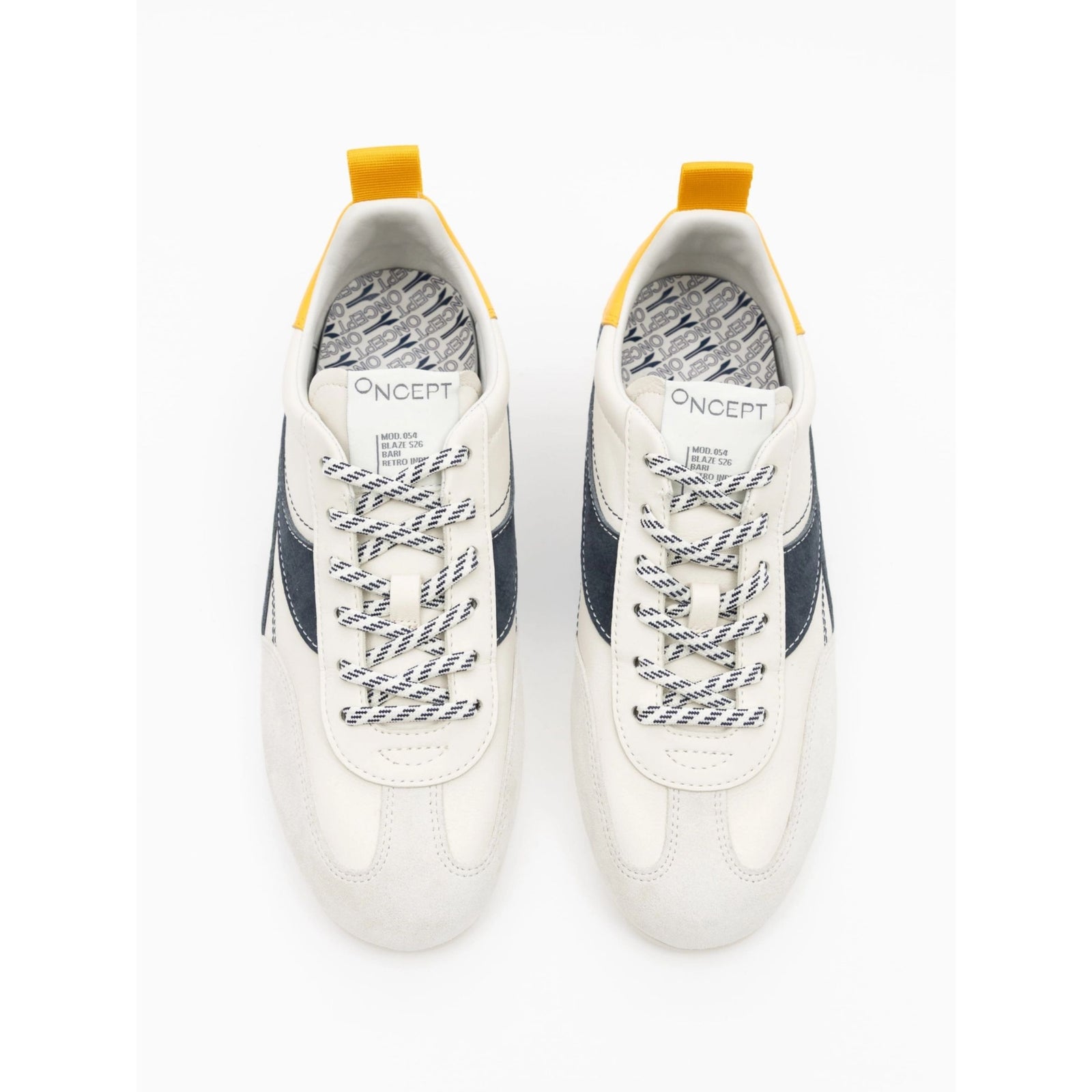 A pair of Oncept low-top sneakers shown from a top-down view. The sneakers are primarily off-white with navy blue side stripes, patterned gray-and-white laces, and bright yellow heel pull tabs.