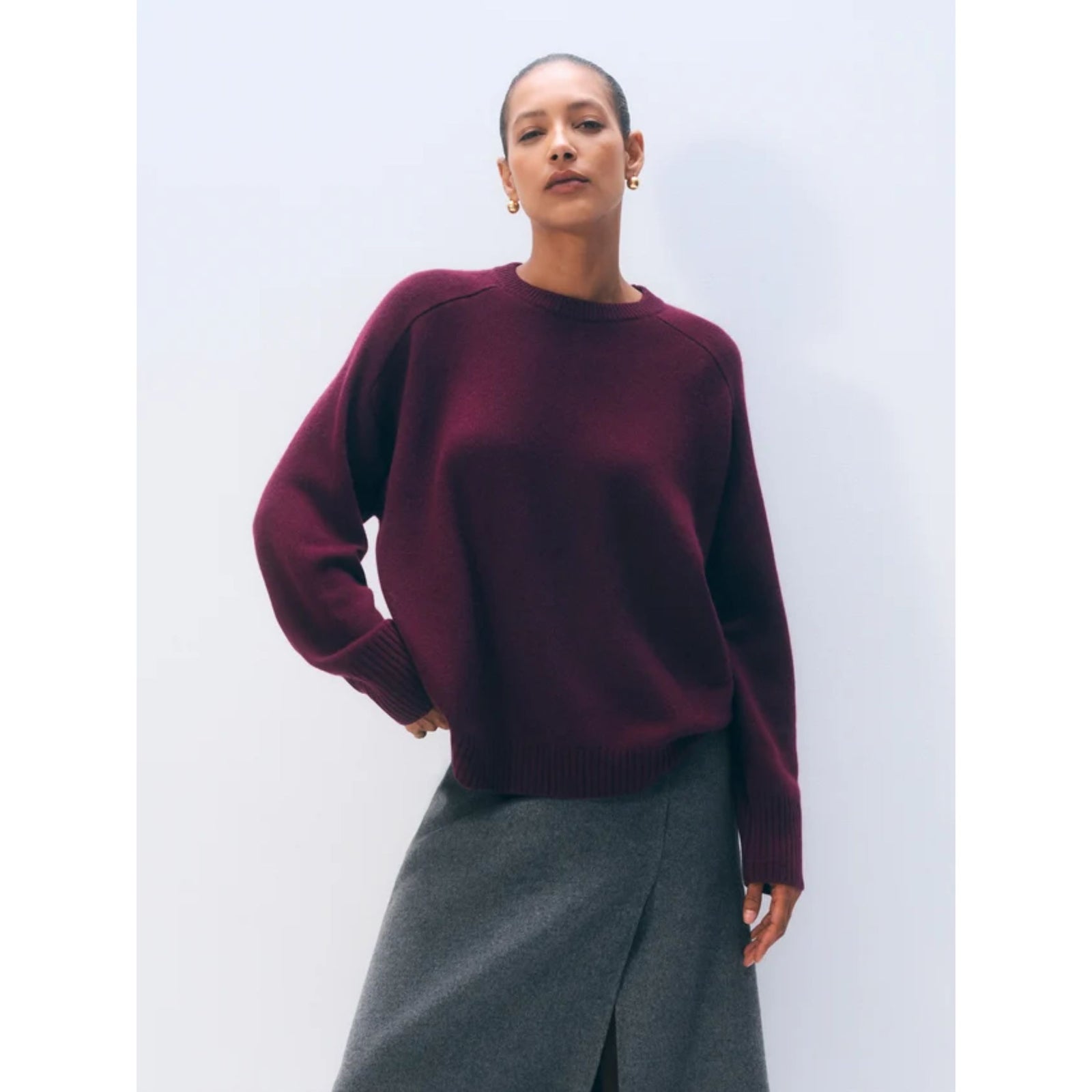 Front flat lay view of the long-sleeve "Cashmere Crew" sweater in Sangria deep burgundy wine red against a plain light background.