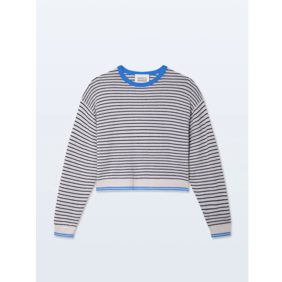 A cropped long-sleeve knit sweater with horizontal navy and gray stripes, featuring a bright blue crew neck, hem, and sleeve trim, displayed flat against a light gray background.