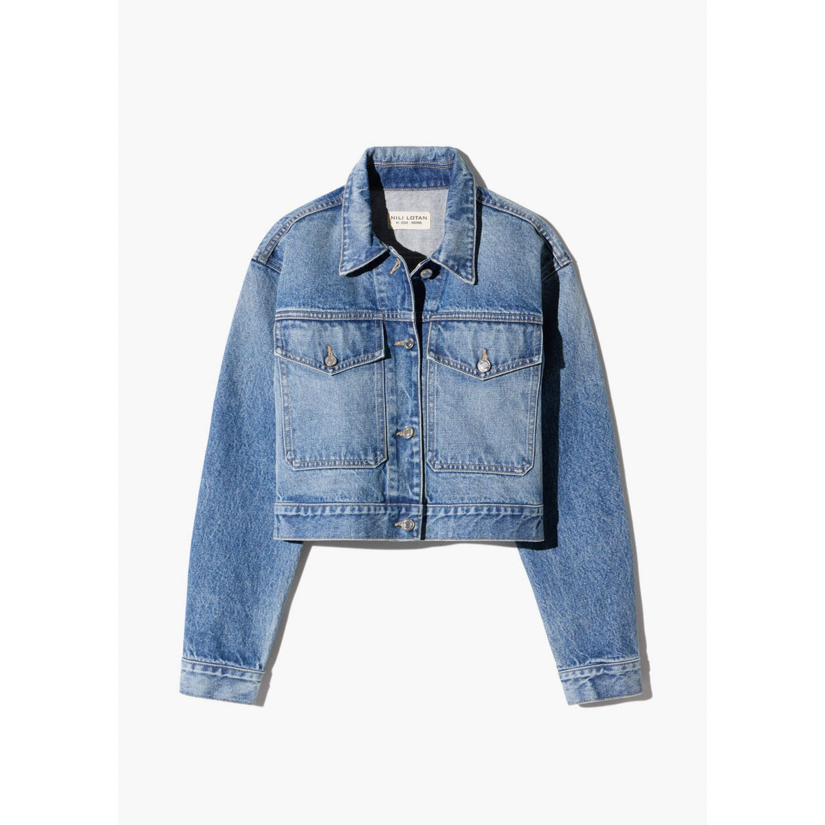 Front flat lay view of the "Clement Denim Jacket" in Rosebowl Wash, featuring a cropped silhouette, button-front closure, flap chest pockets, and long sleeves.
