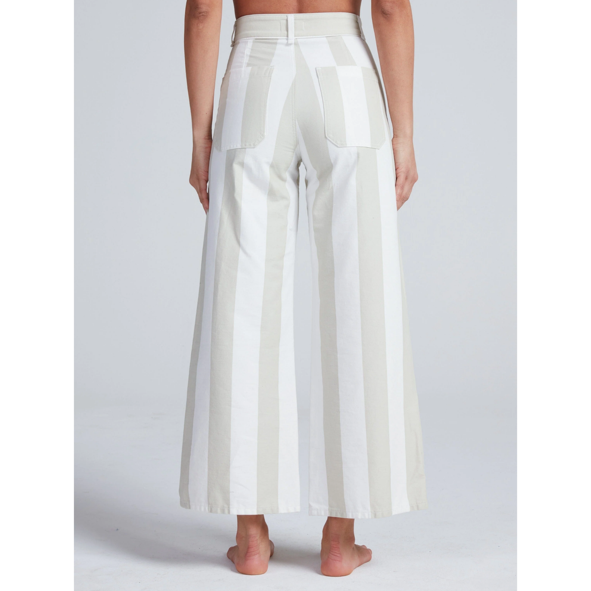 White wide-leg pants worn by a person on a white background