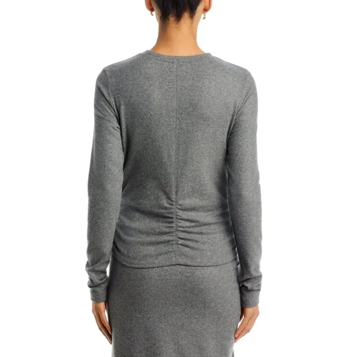 A woman shown from the back wearing a heather gray long-sleeve knit top and matching skirt against a plain white background.