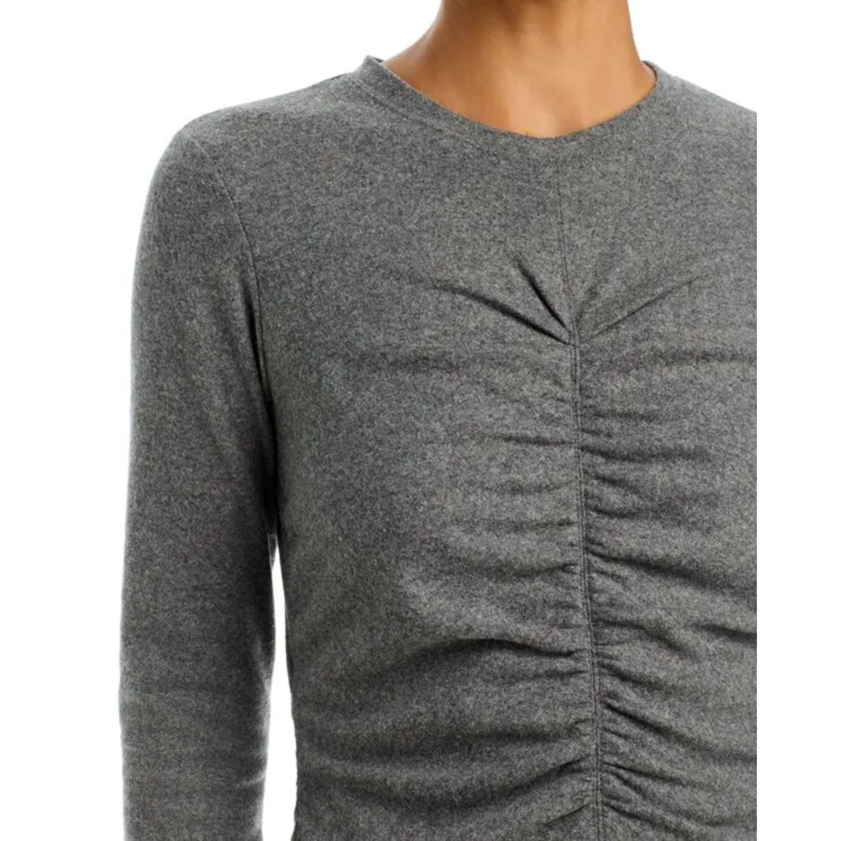 A close-up of a person wearing a heather gray long-sleeve top with a gathered ruched front detail, shown against a plain white background.
