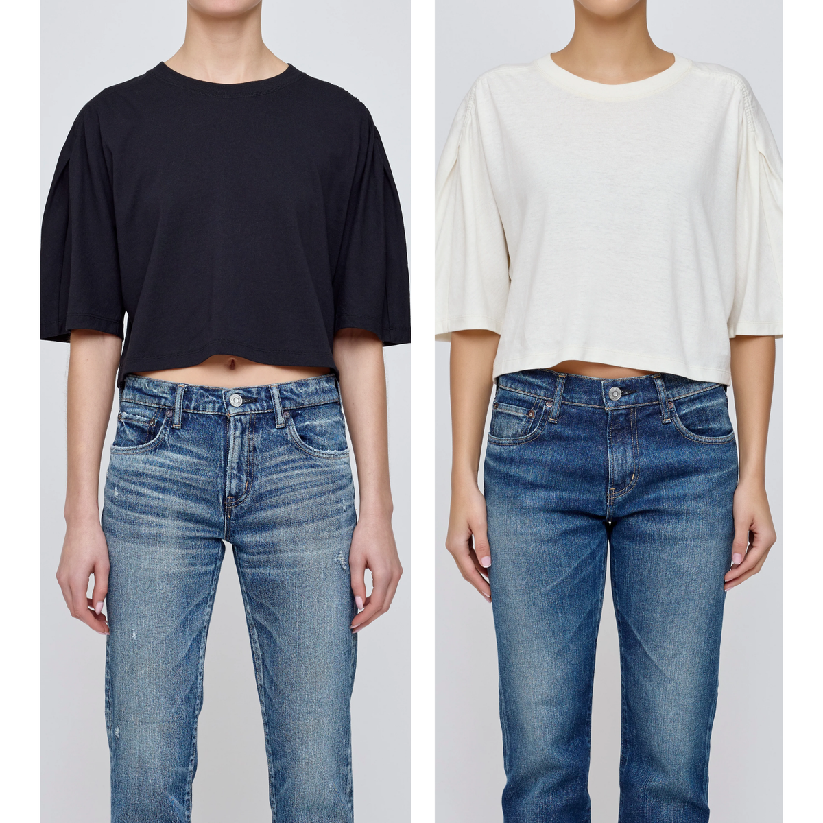 Two people wearing black and white shirts with blue jeans on a plain background