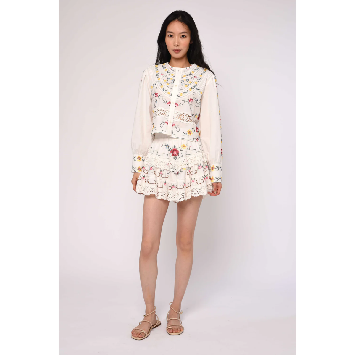 Woman wearing a floral dress on a white background