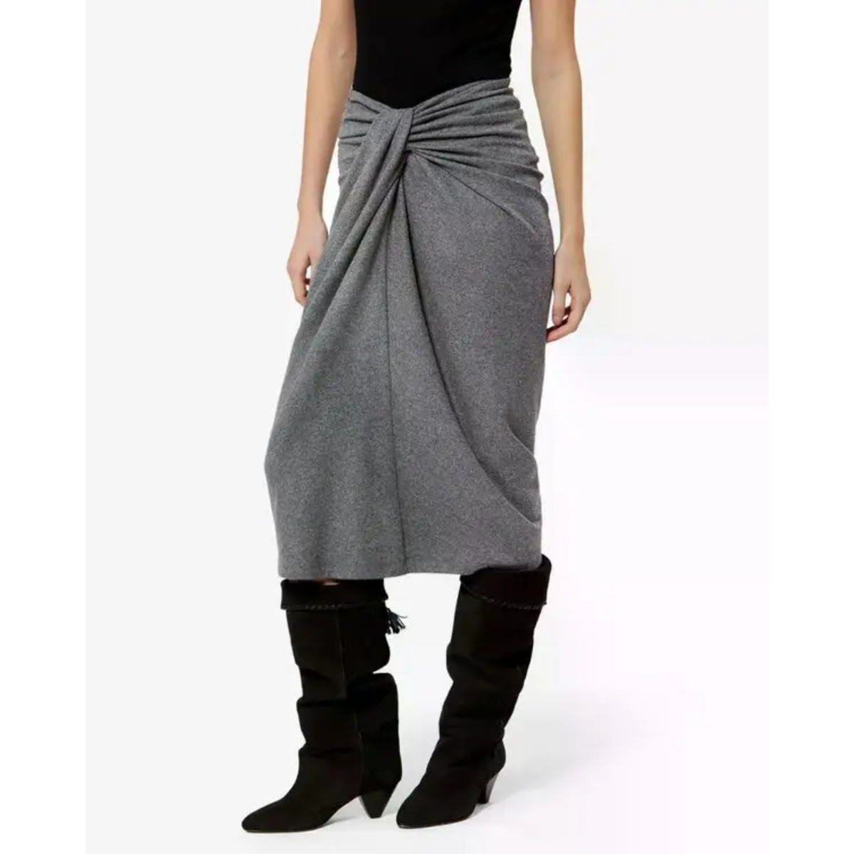 A model wearing a gray draped wrap skirt with a knotted waist, styled with a black top and black knee-high boots against a plain white background.
