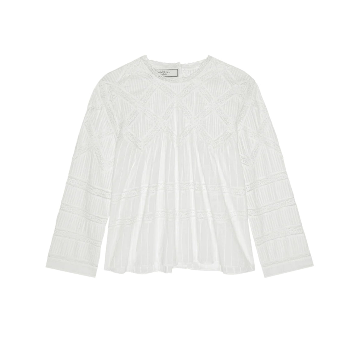 A white long-sleeve blouse with intricate geometric embroidery and pleated detailing, presented flat against a solid white background.