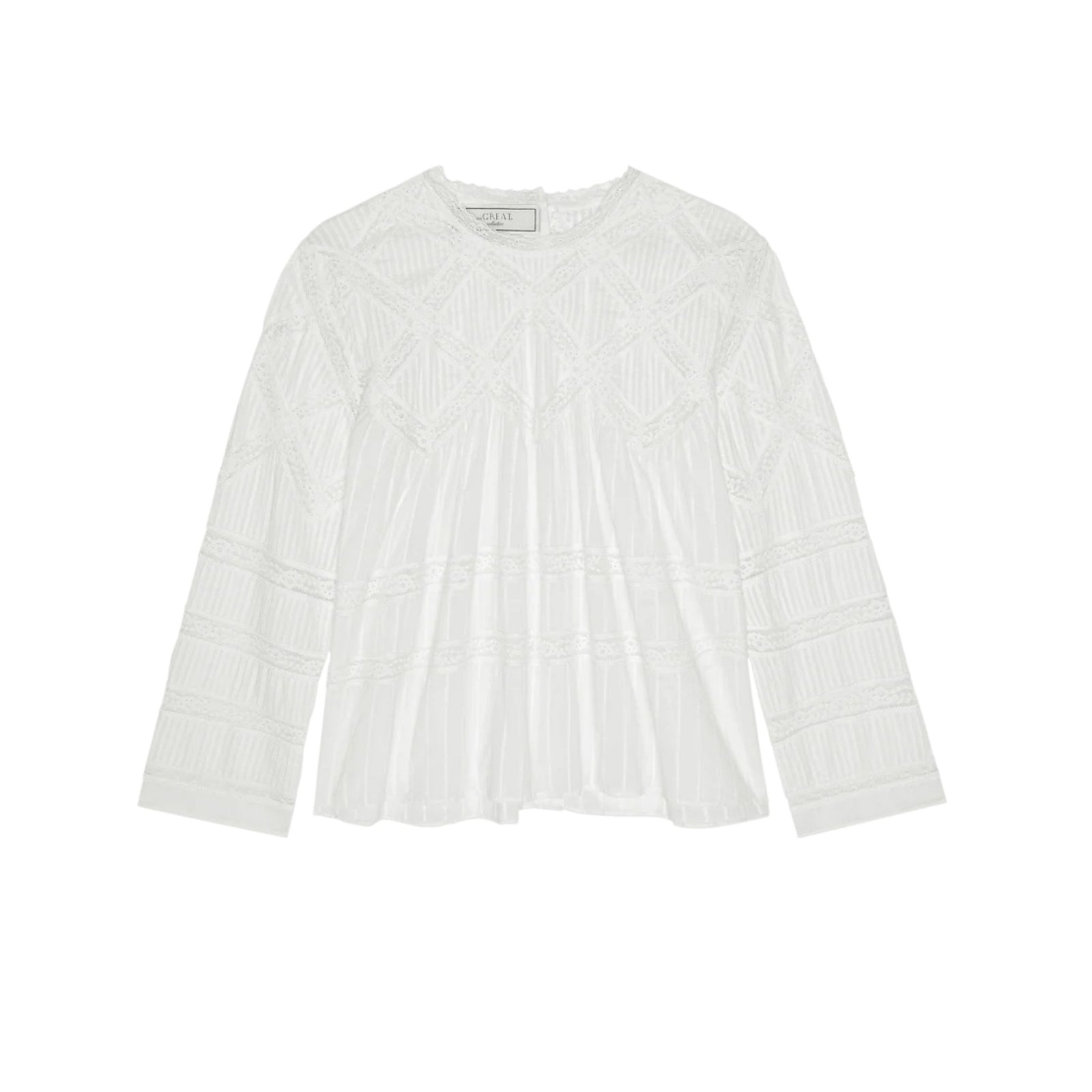 A white long-sleeve blouse with intricate geometric embroidery and pleated detailing, presented flat against a solid white background.