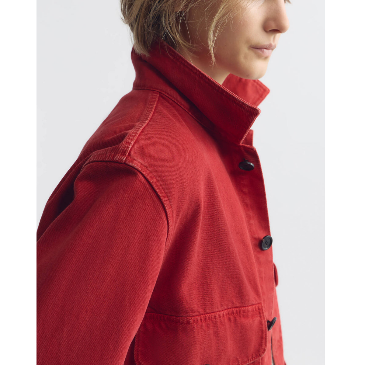 Red jacket worn by a person on a white background
