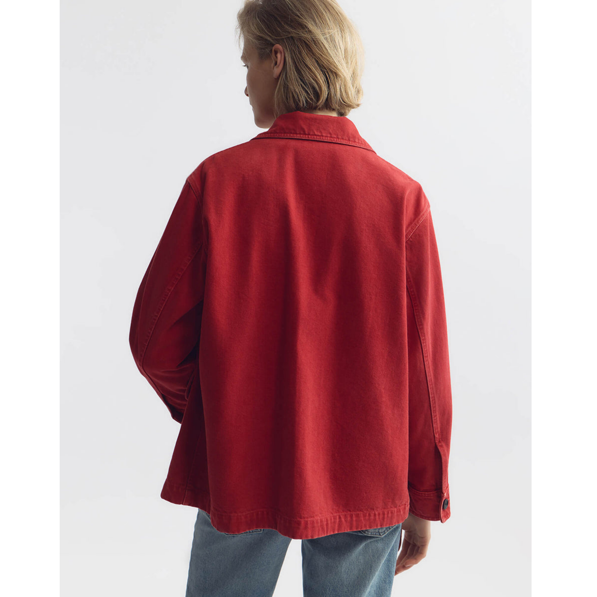 Person wearing a red jacket on a white background
