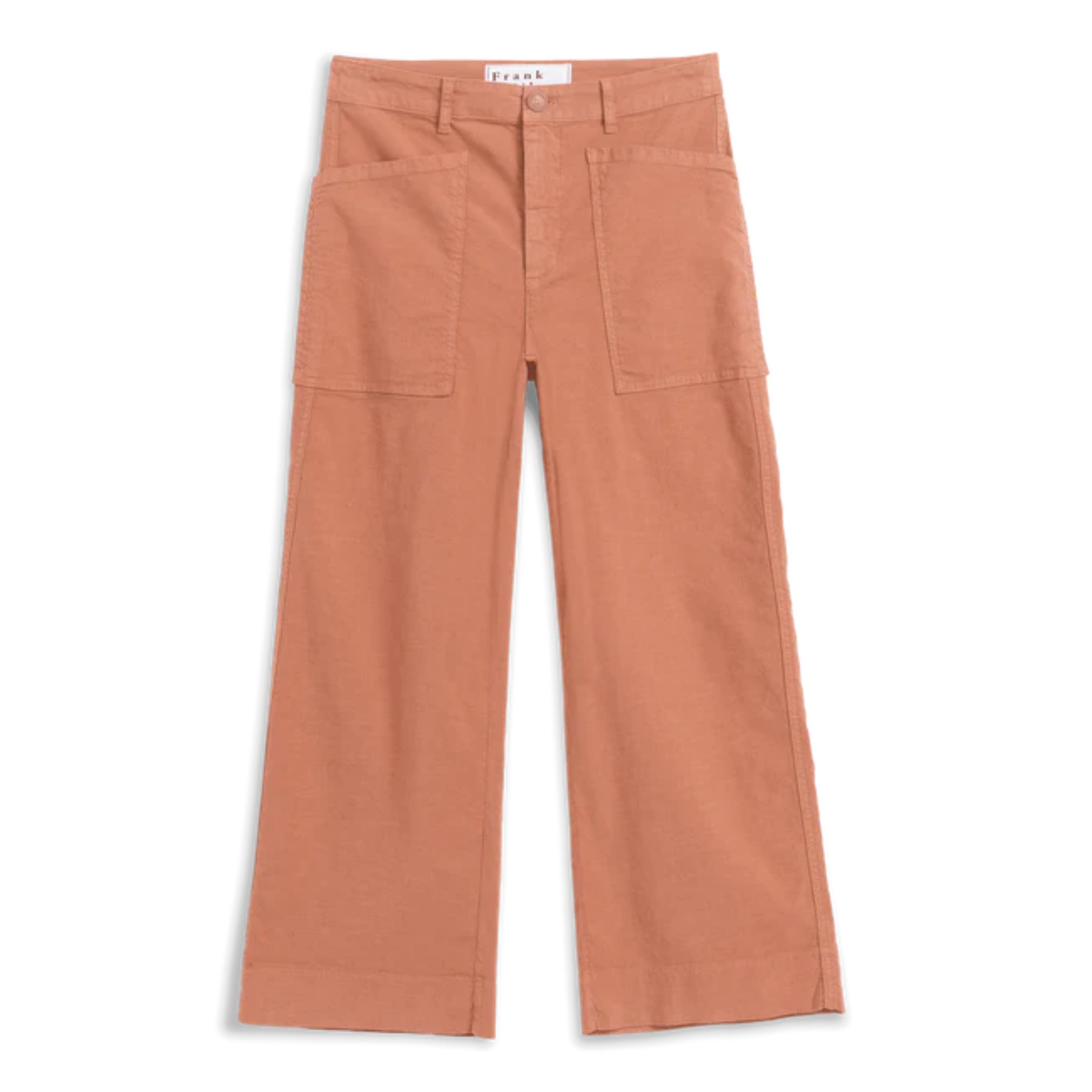 A pair of wide-leg cropped pants in a warm terracotta or burnt orange color, featuring a button fly, belt loops, and two large patch pockets on the front, laid flat against a white background.
