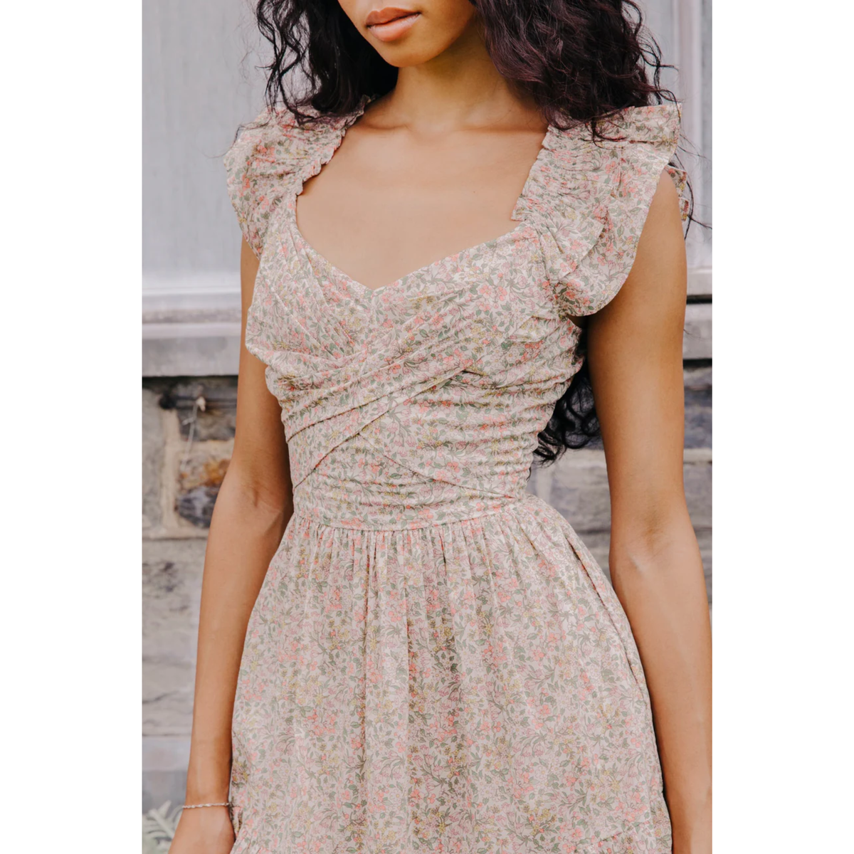 Woman wearing a floral dress with a blurred background