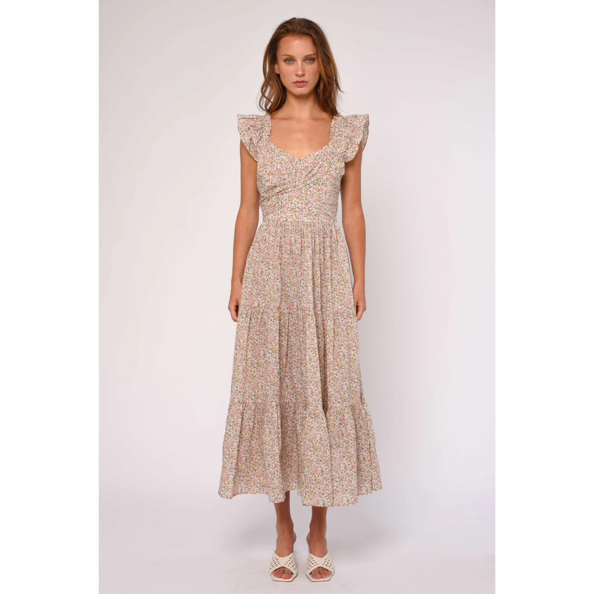 Woman wearing a floral dress on a white background