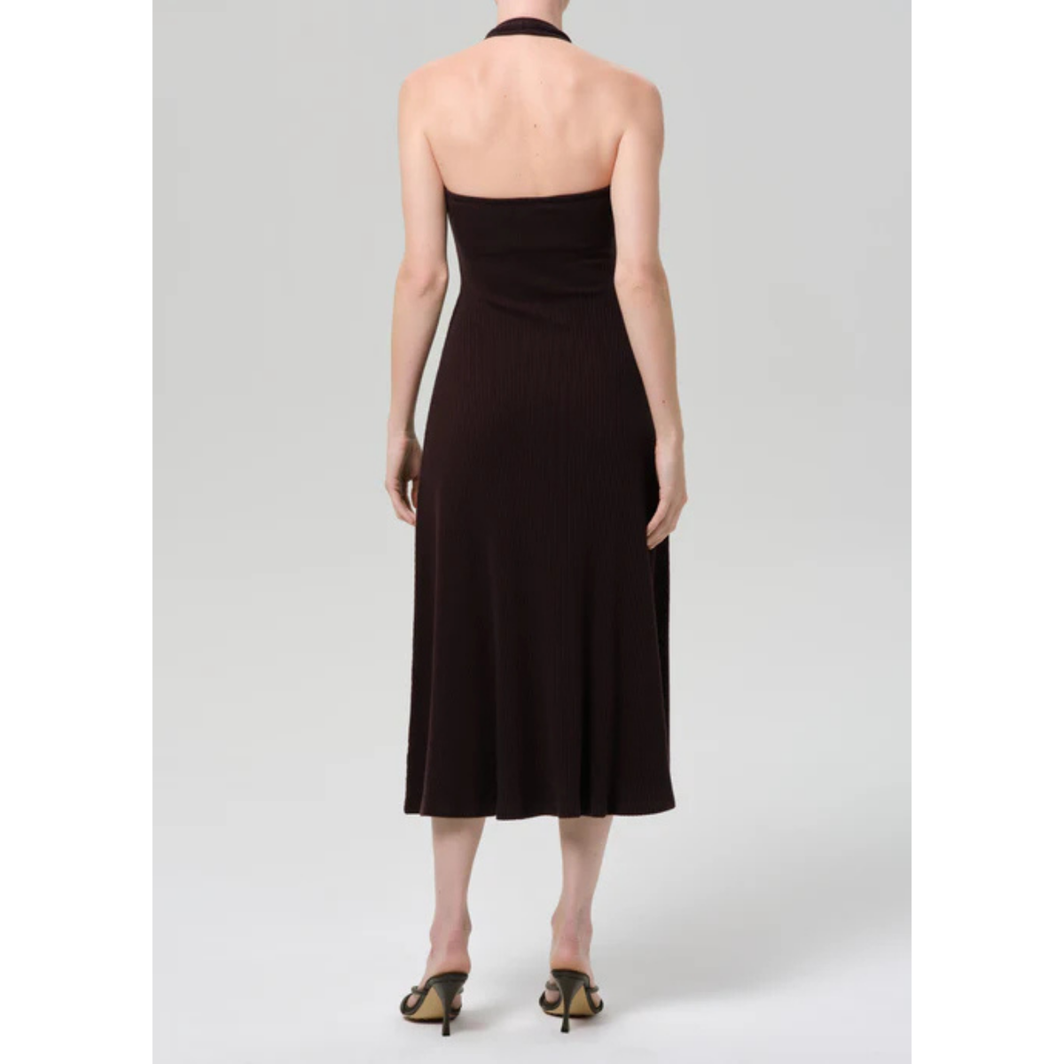 Black halter neck dress on a white background