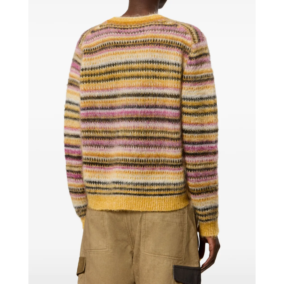 A person shown from the back wearing a fuzzy knit sweater with horizontal multicolor stripes in yellow, pink, beige, brown, and black, paired with tan cargo pants against a plain white background.