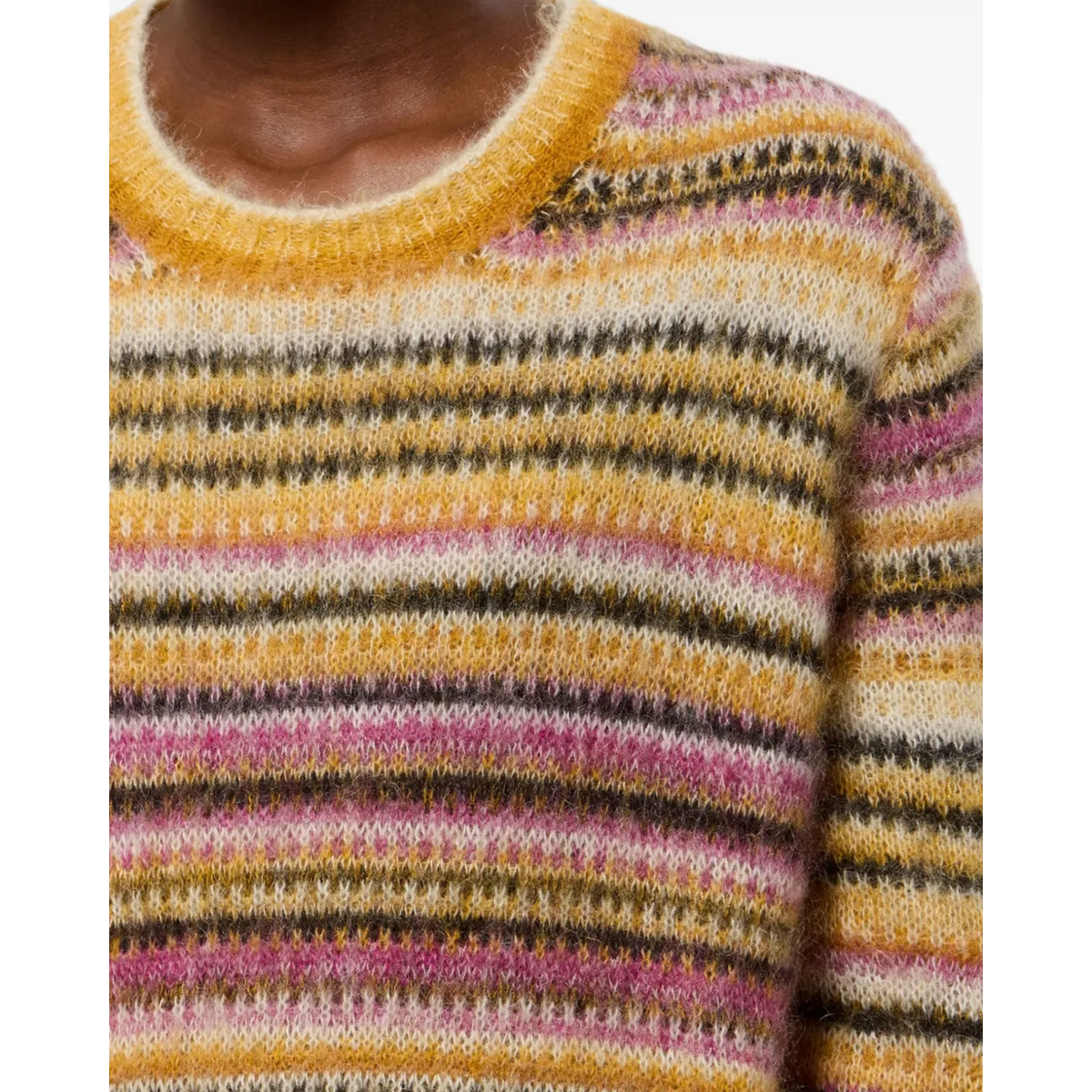 Close-up of a knit crewneck sweater with horizontal stripes in mustard yellow, cream, pink, and dark brown.