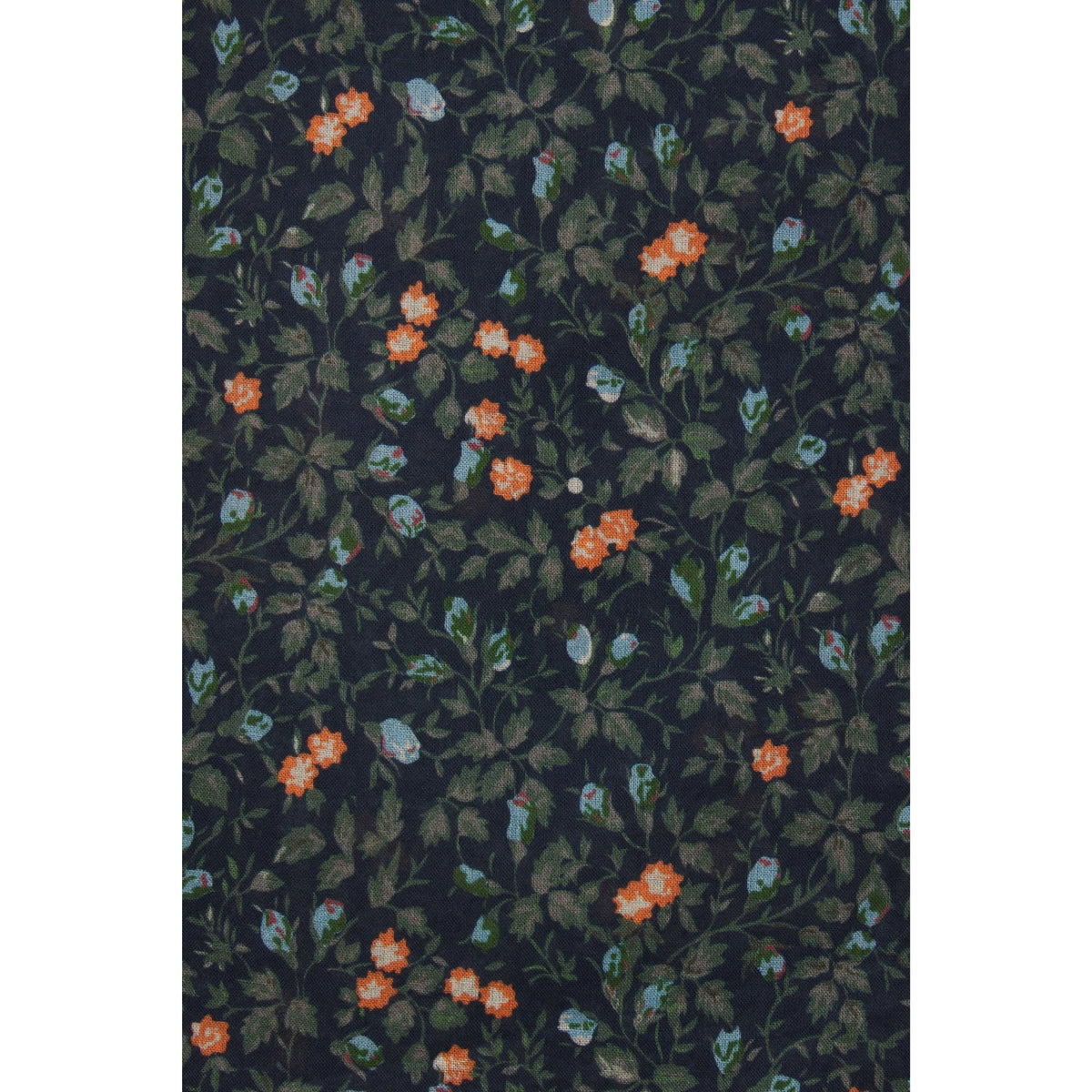A close-up of a dark floral fabric or wallpaper pattern featuring small orange flowers, green leaves, and light blue blossoms on a very dark navy or black background.