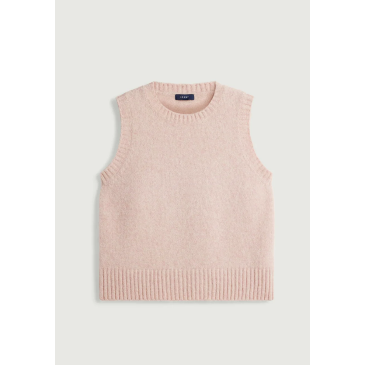 A sleeveless knit sweater vest in a soft dusty pink color, shown flat against a light gray background.