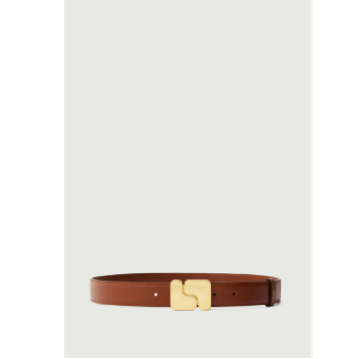 A brown leather belt with a distinctive gold-tone metal buckle, displayed horizontally against a light gray background.