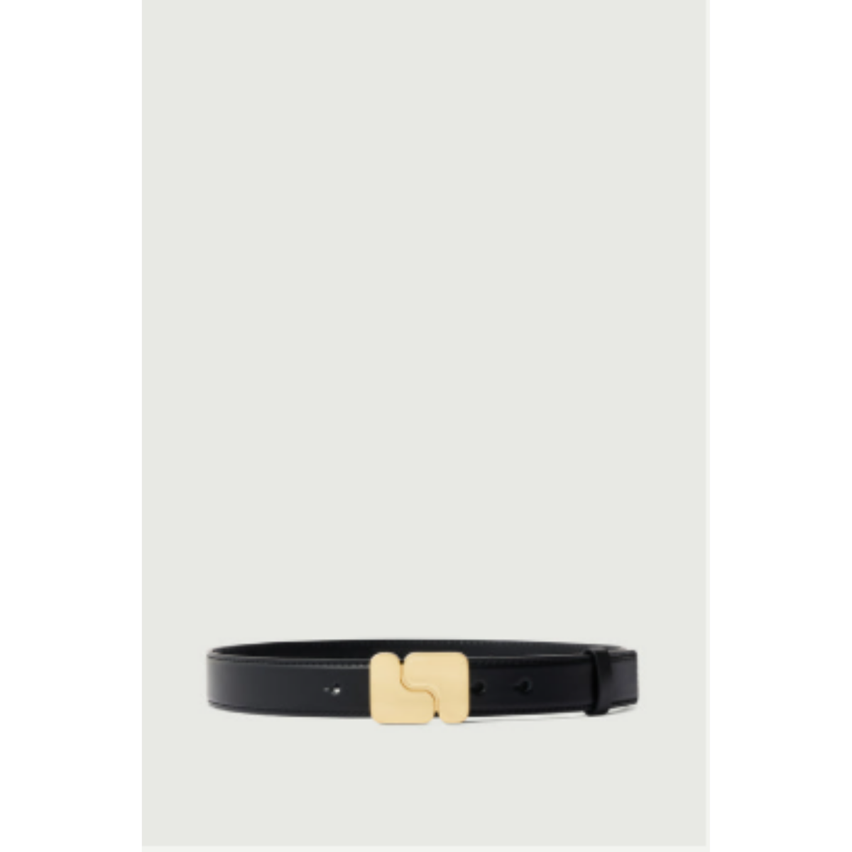 A slim black leather belt with a distinctive gold-tone metal buckle, displayed horizontally against a light gray background.