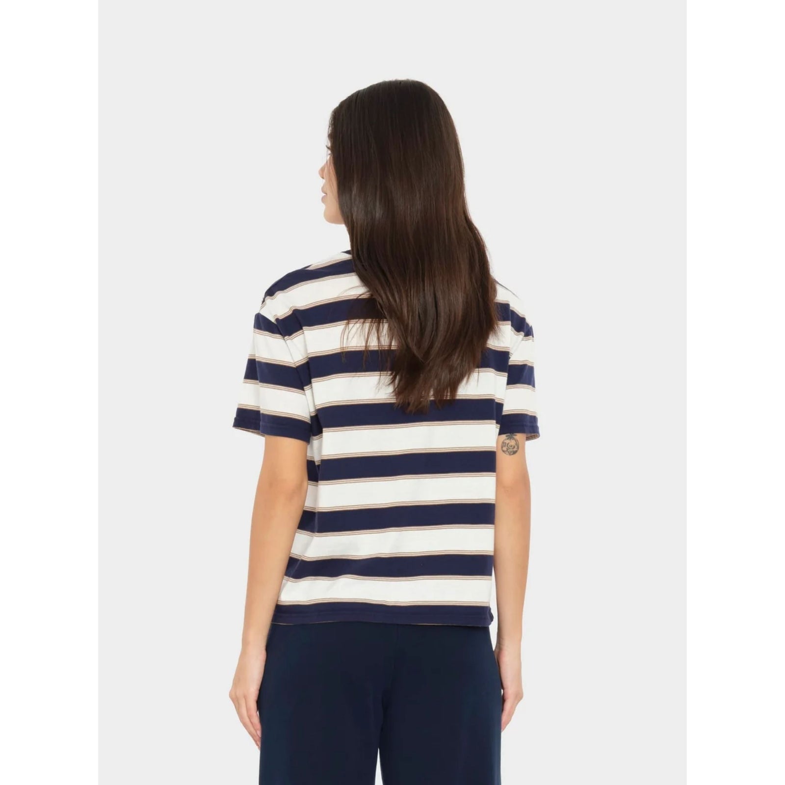 A short-sleeve crewneck t-shirt with horizontal navy blue and cream stripes, featuring a small chest pocket on the left side, displayed flat against a light gray background.