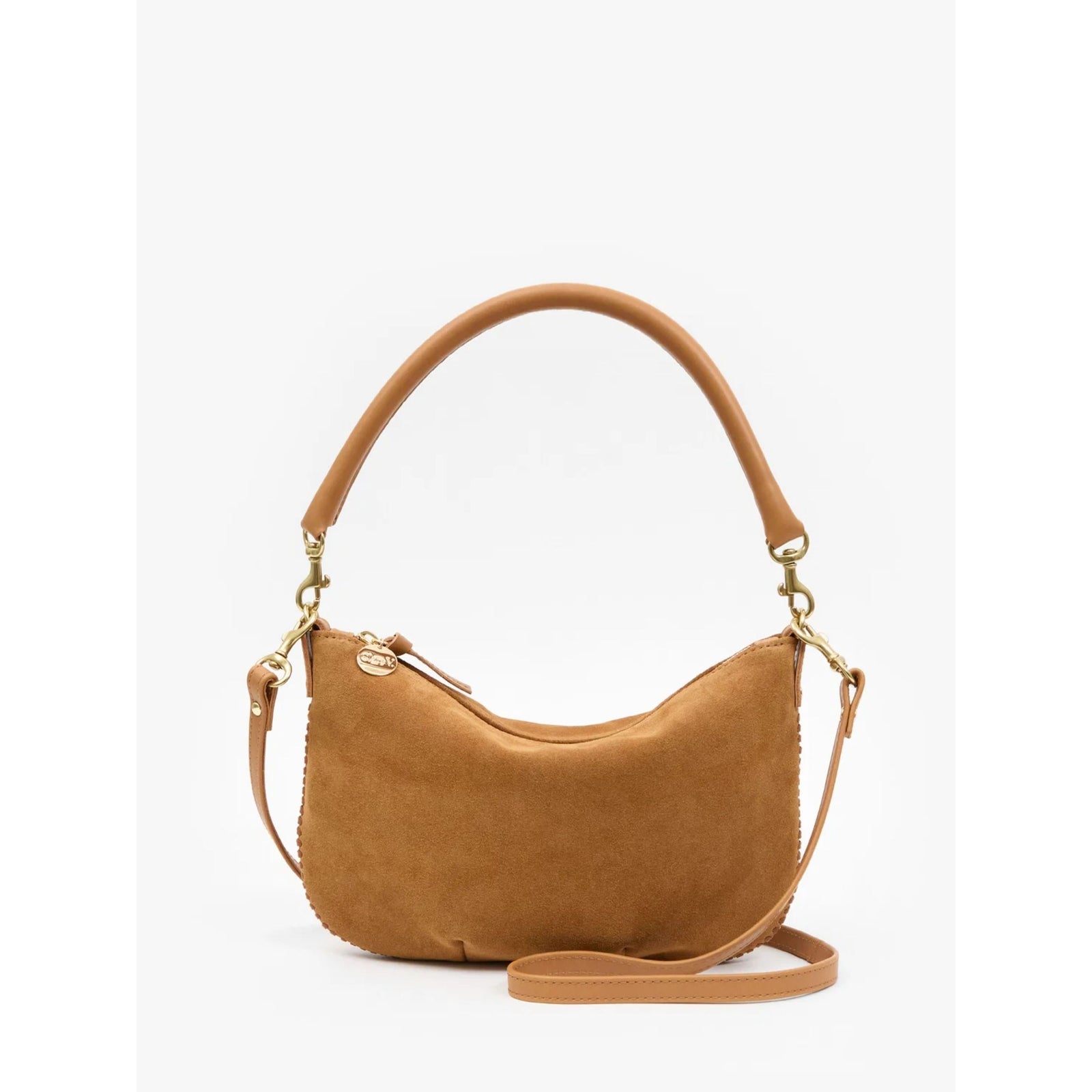 Front view of the "Petit Moyen" shoulder bag in Caramel brown suede featuring cream whipstitch detailing along the top handle and an adjustable shoulder strap against a plain background.