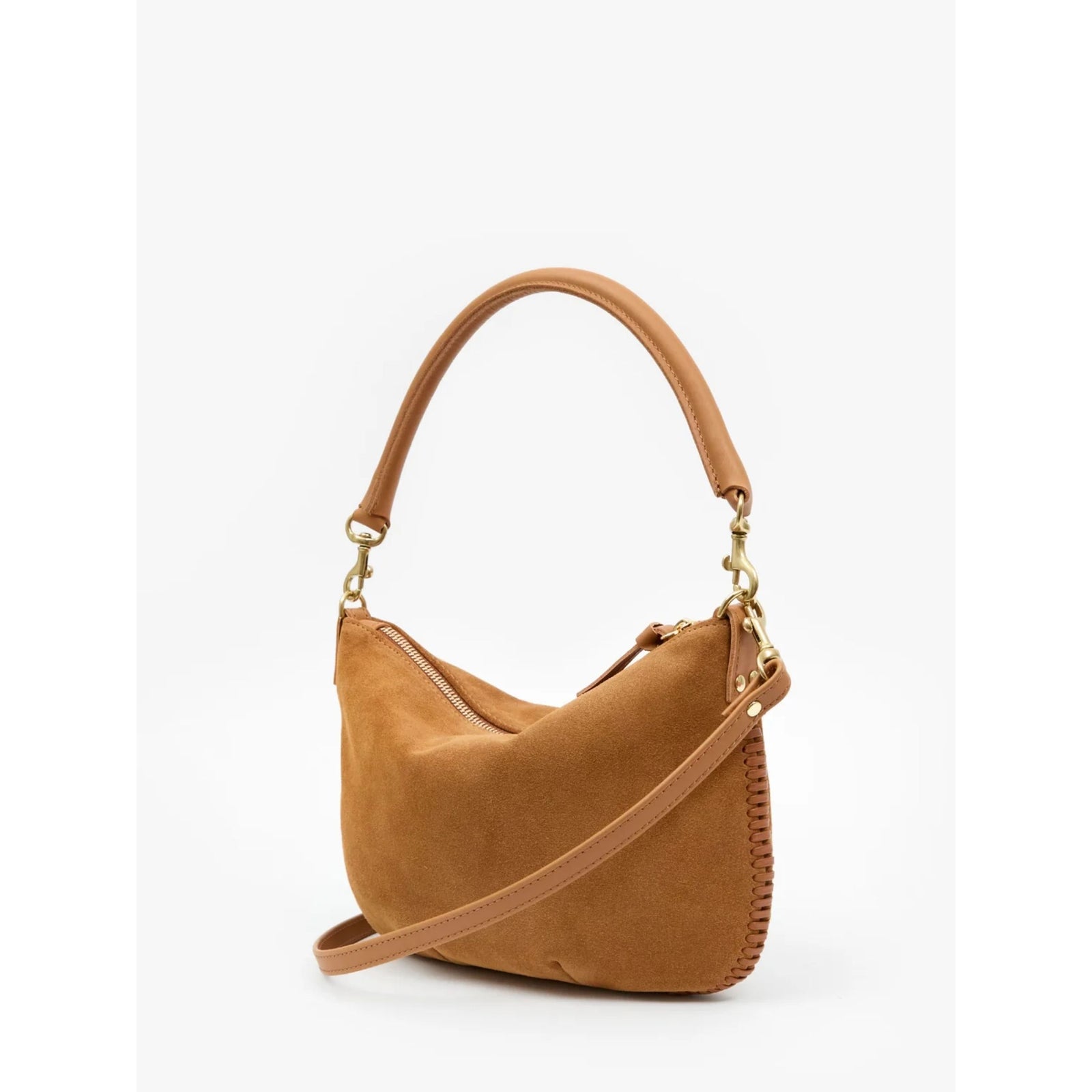 Front view of the "Petit Moyen" shoulder bag in Caramel brown suede featuring cream whipstitch detailing along the top handle and an adjustable shoulder strap against a plain background.