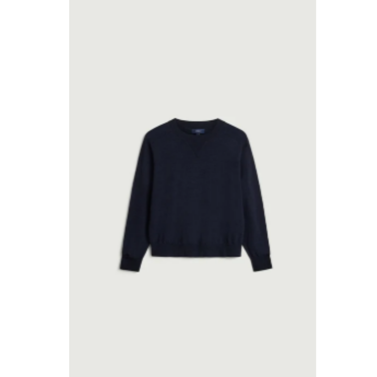A dark navy blue long-sleeve crewneck sweater displayed flat against a light gray background.