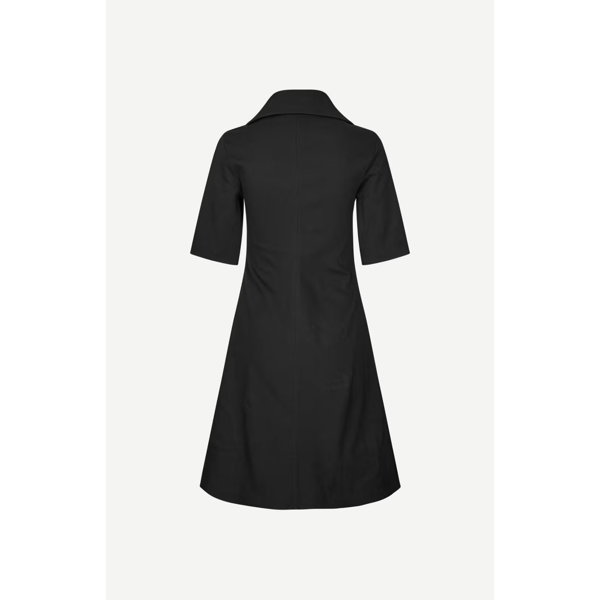 A black short-sleeve collared dress shown from the back, photographed against a light gray studio background.
