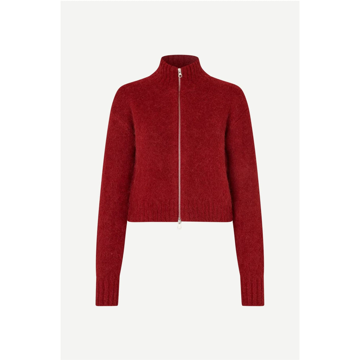 A cropped, long-sleeve knit zip-up jacket in a deep red or burgundy color, featuring a mock neck and a silver-tone front zipper, shown against a light gray background.