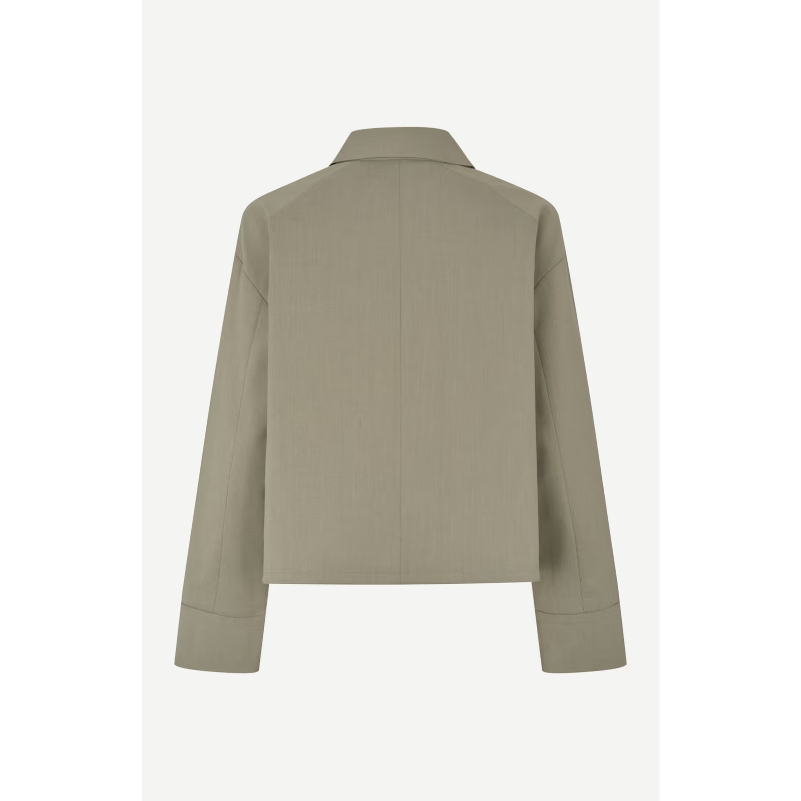 A cropped long-sleeve button-up jacket in a muted sage green color, featuring a pointed collar, dark buttons, and two front flap pockets, shown against a light gray background.