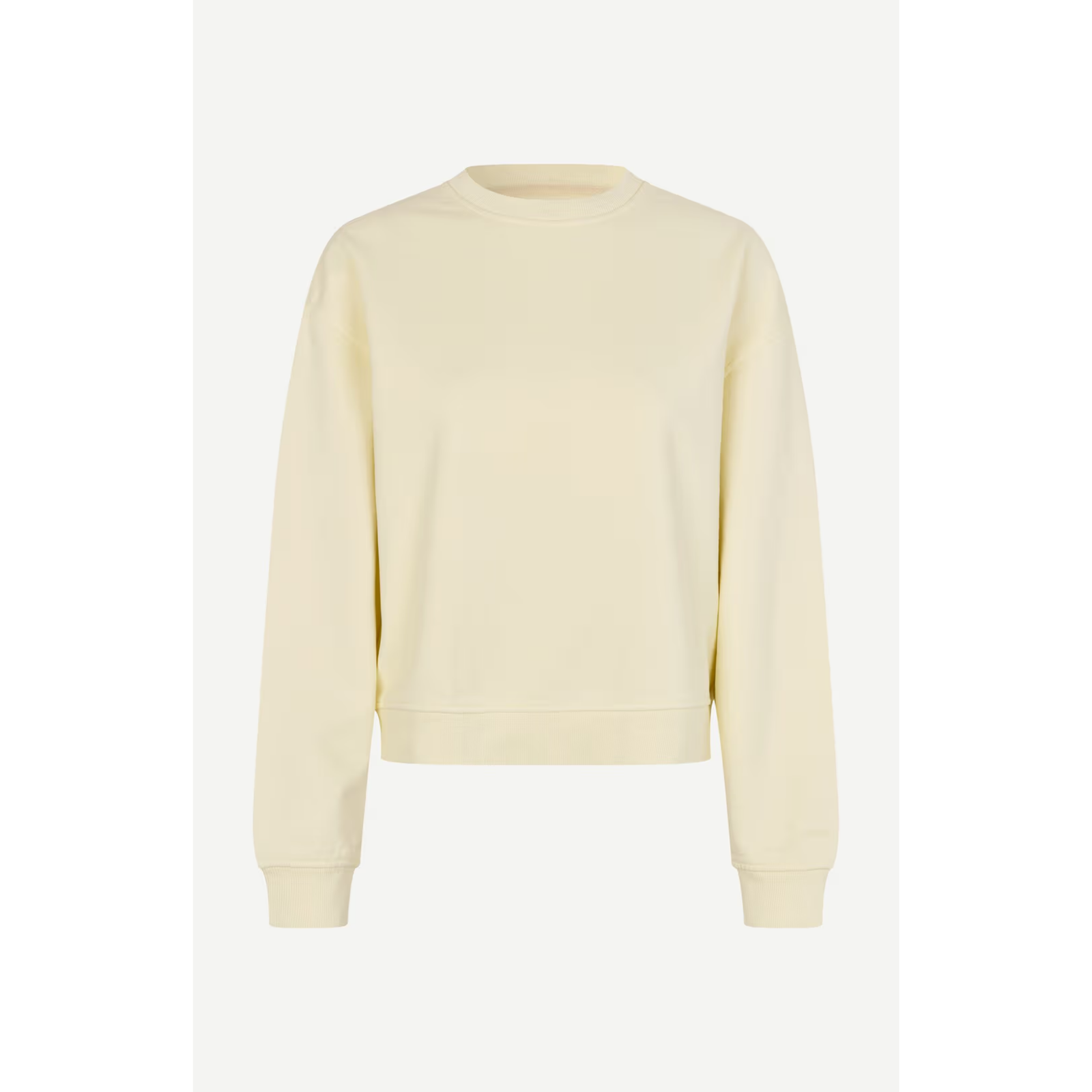 A pale cream-colored crewneck sweatshirt with long sleeves and ribbed cuffs, displayed on a clean white background.