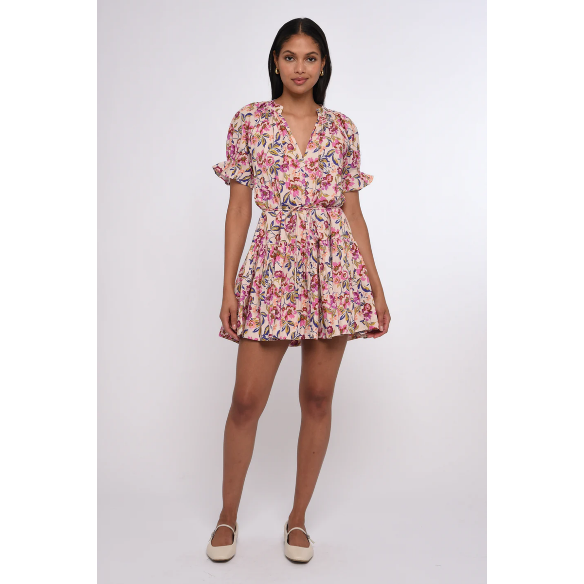 Woman wearing a floral dress on a white background