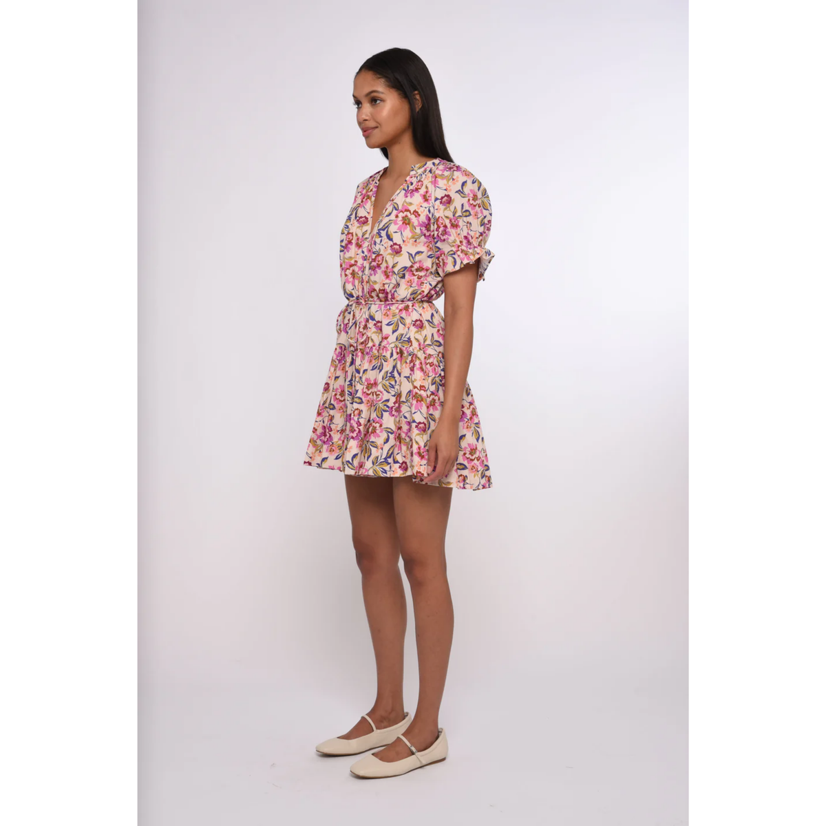 Woman wearing a floral dress on a white background