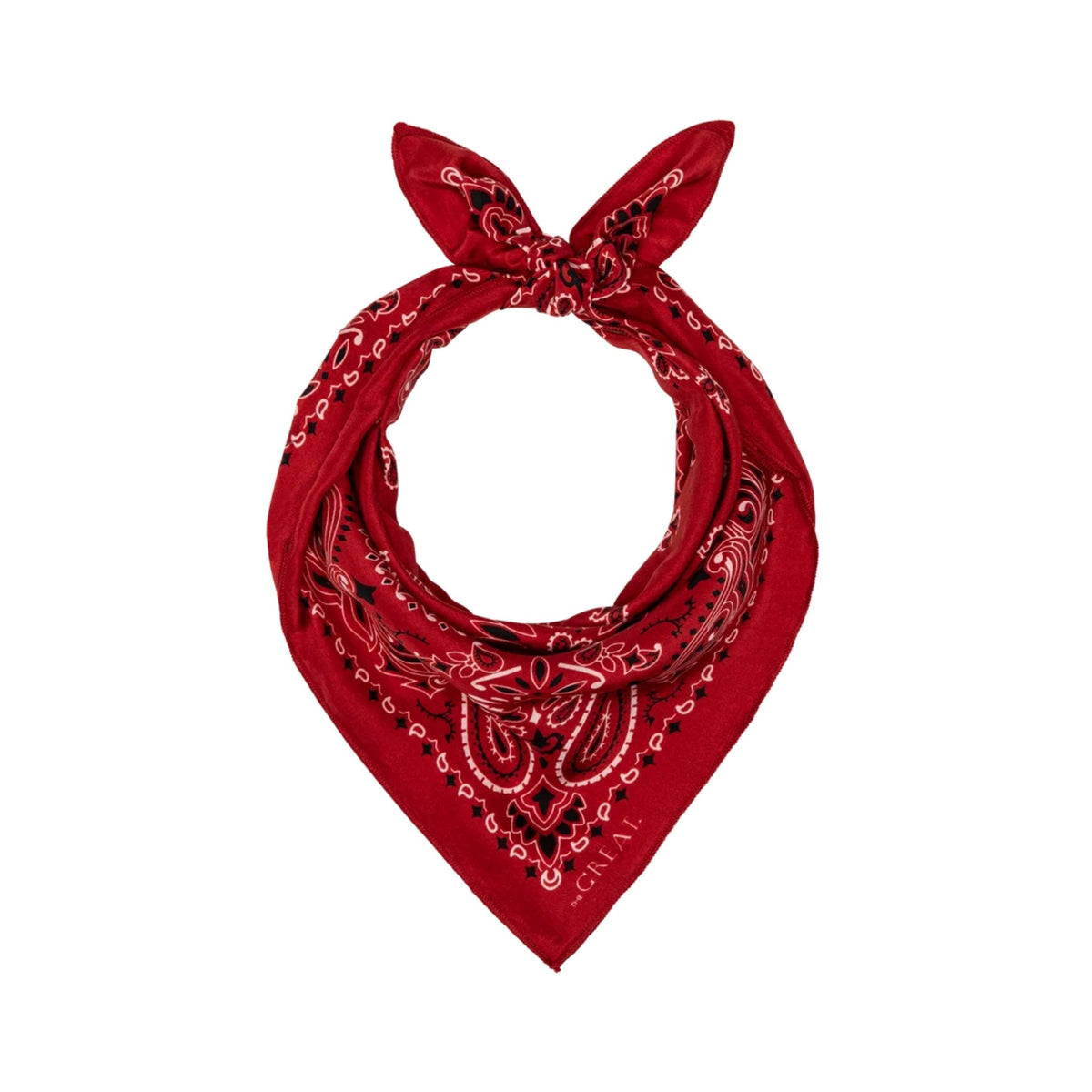 A red bandana-style neck scarf with black and white paisley patterns, tied in a loop at the top and pointed down, shown on a plain white background.