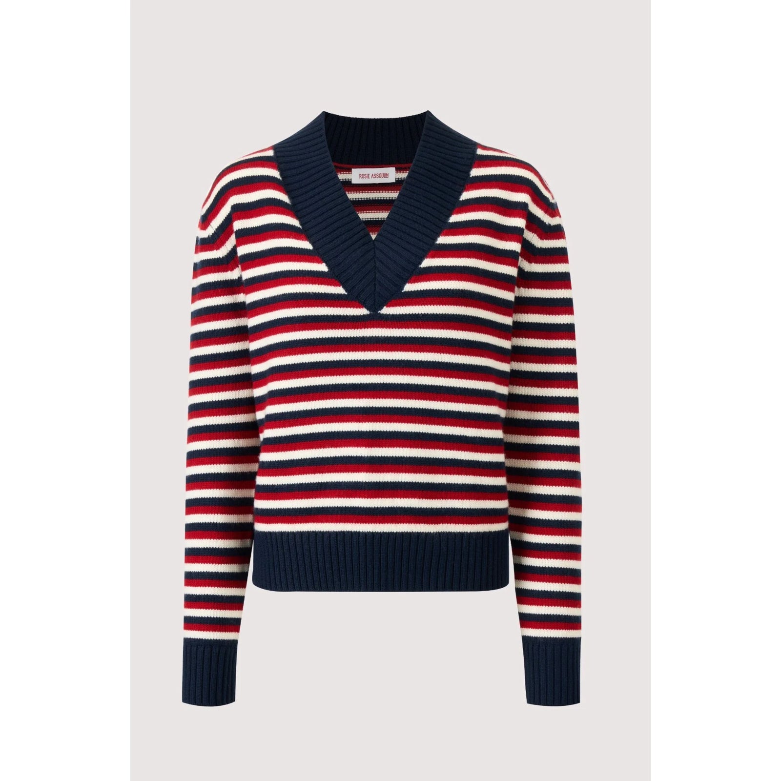 A striped knit sweater with a V-neck, featuring horizontal navy blue, red, and off-white stripes, displayed on a neutral light gray background.