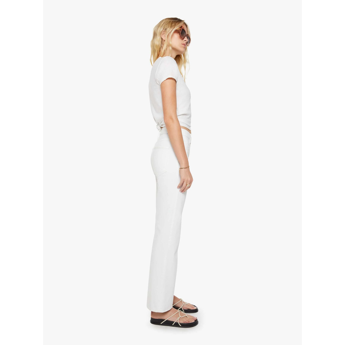 Woman wearing a white outfit on a white background