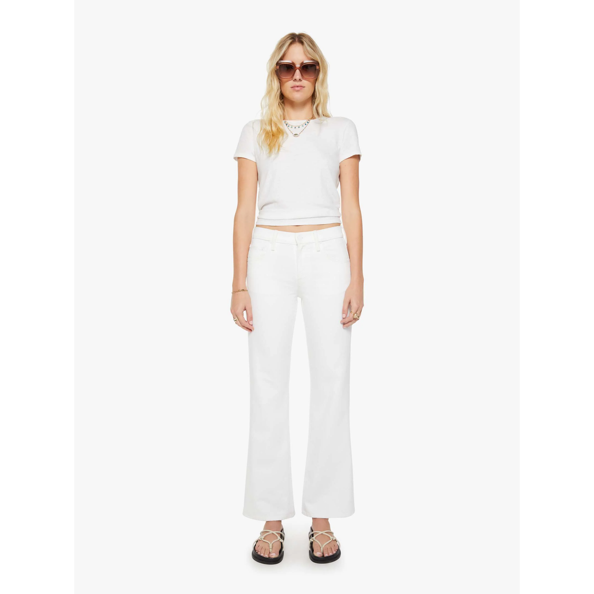 Woman wearing a white outfit on a white background