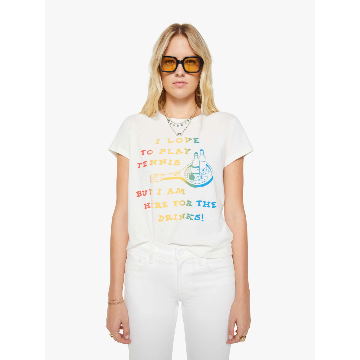 Woman wearing a white t-shirt with colorful text and graphics on a white background