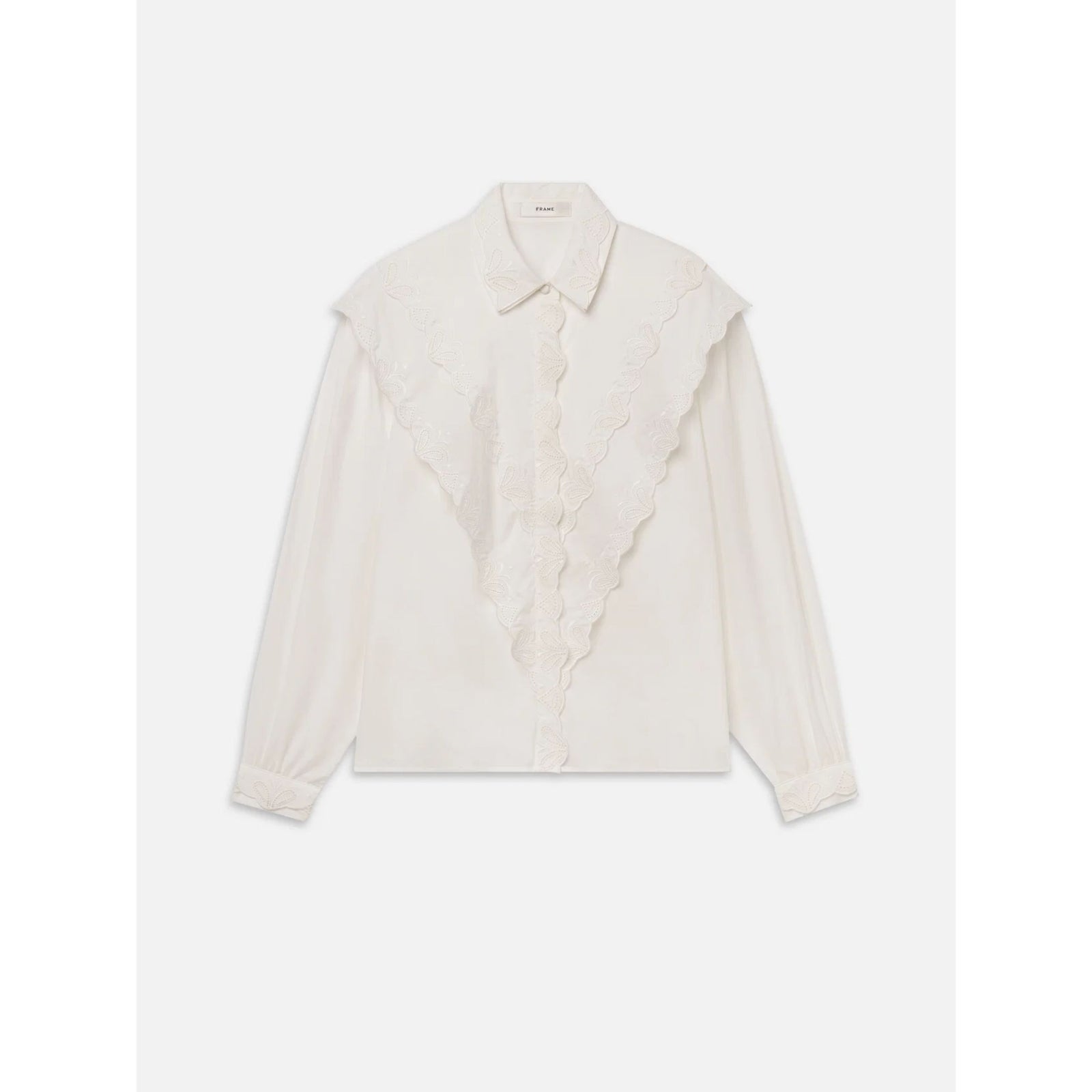 An off-white long-sleeve blouse featuring a large, layered ruffled collar and matching lace trim down the front center, displayed flat against a light gray background.