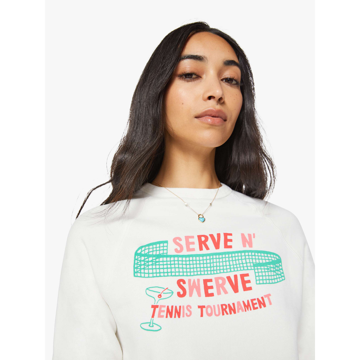 Woman wearing a white sweatshirt with 'Serve N' Swerve Tennis Tournament' text and graphics.