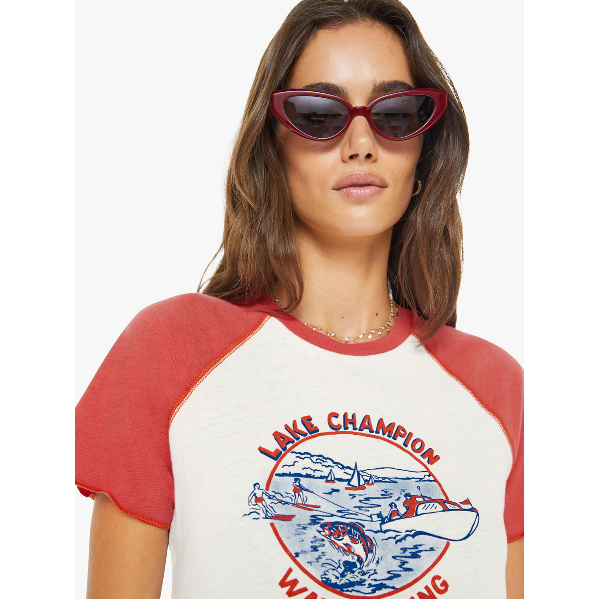 Woman wearing a red and white t-shirt with a graphic design on a white background