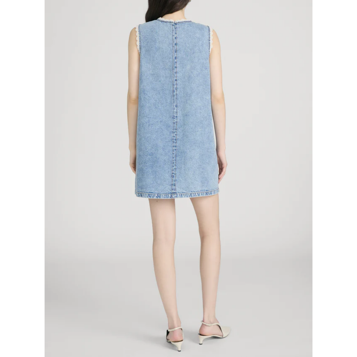 Light blue denim dress on a white background