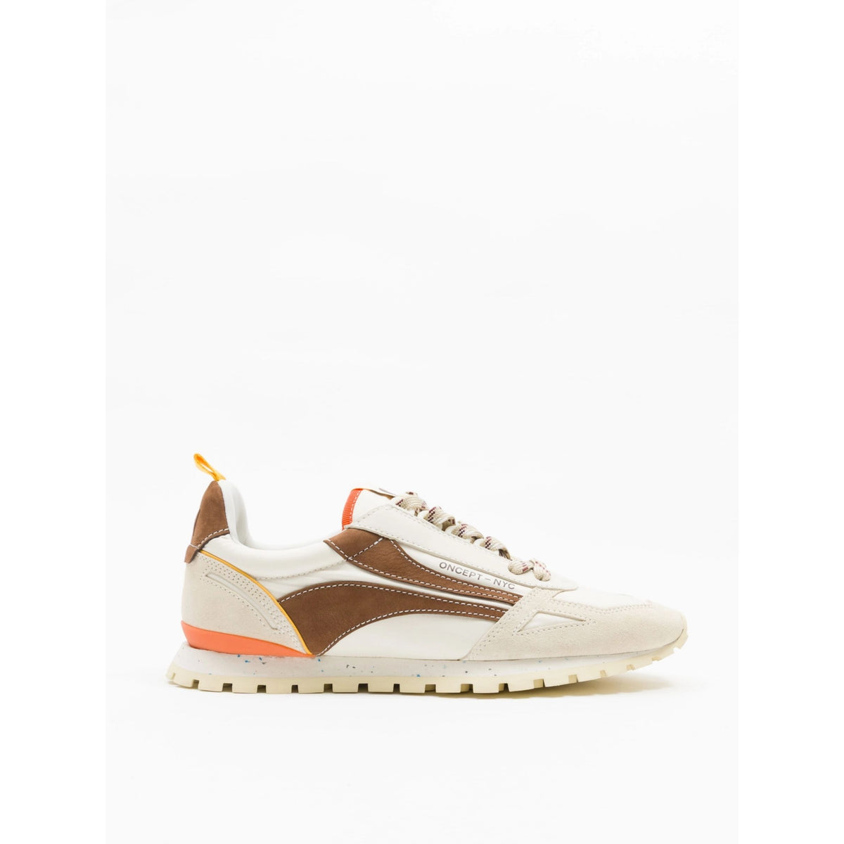 A low-top sneaker in off-white and brown suede with a bright orange accent on the midsole and heel pull tab, shown in a side profile against a plain white background.