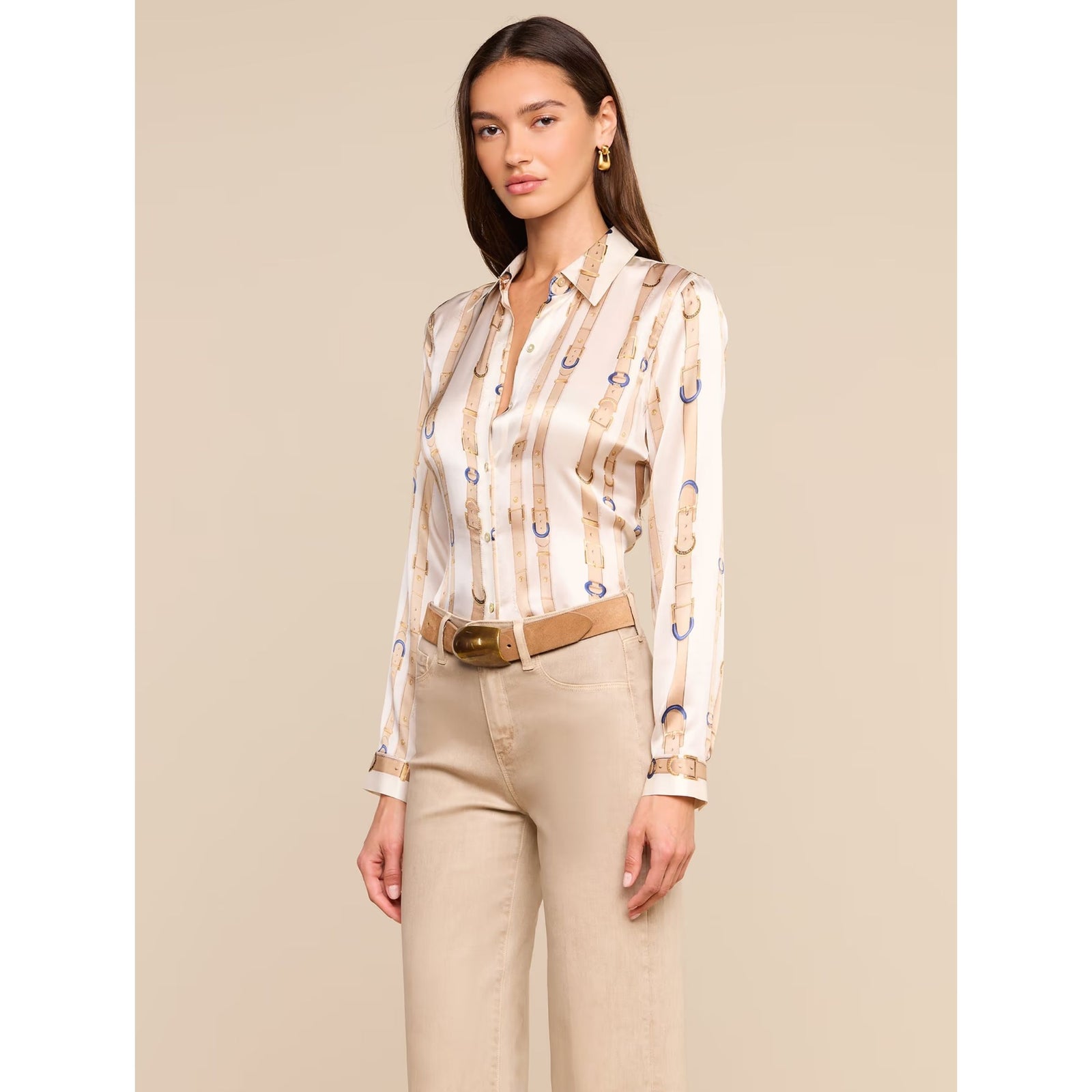 A long-sleeve button-up shirt by Viktor & Rolf, featuring a vertical strap print in beige and tan with blue accents on a white base, displayed against a solid beige background.