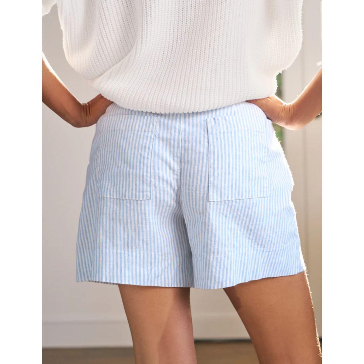 Light blue striped shorts worn by a person with a white top.